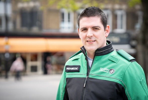 An image of a smiling man wearing St John Ambulance uniform and a "Paramedic" role bar