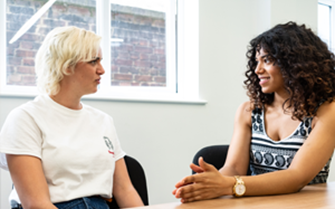 Two people having a conversation. Two people having a conversation.