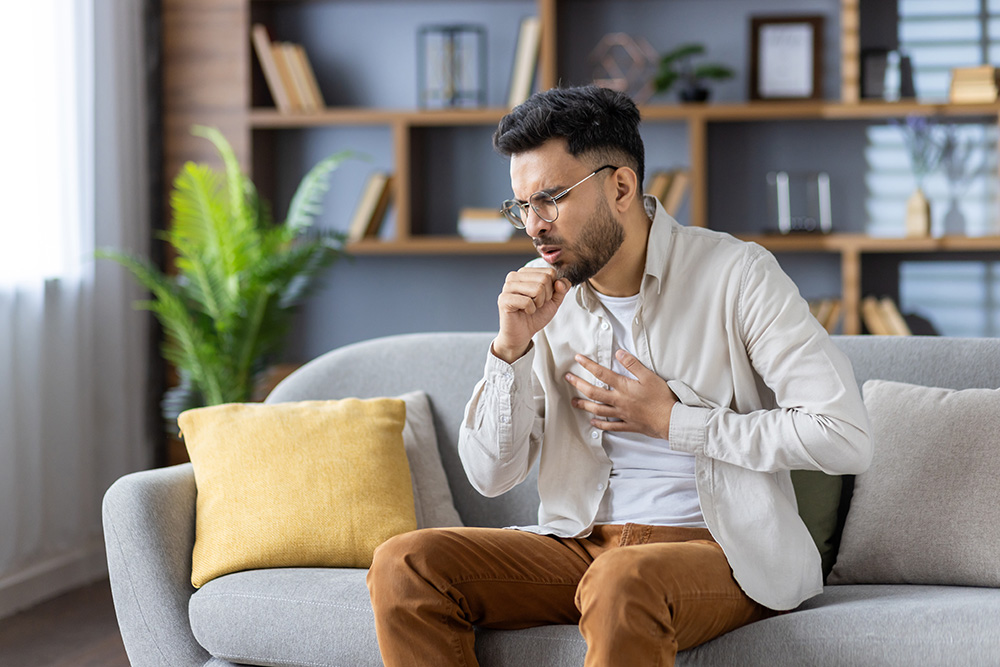 A man coughing.