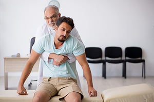 A man helping a person in an emergency situation.
