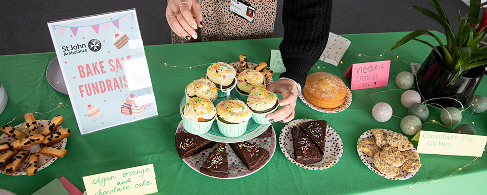An arrangement of baked treats on a table of a St John Ambulance fundraiser.
