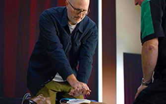 A man learning first aid skills. A man learning first aid skills.