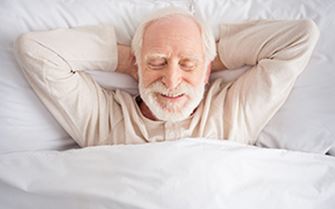 A man in bed, sleeping. A man in bed, sleeping.