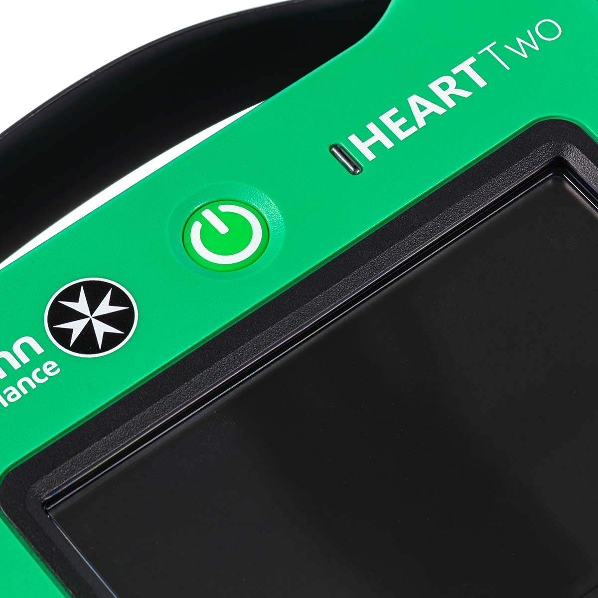 An extreme close-up of the St John Ambulance HEART Two Semi-automatic Defibrillator.
