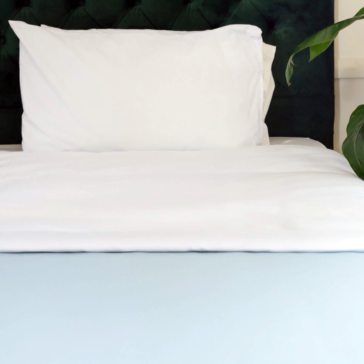 A practical use of the Interweave Single Use Fleece Blanket, on a bed.