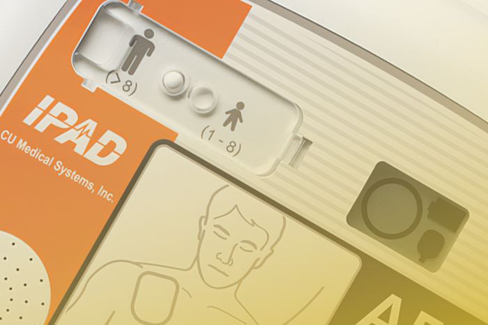 An extreme close-up of the iPAD SP1 fully automatic defibrillator.
