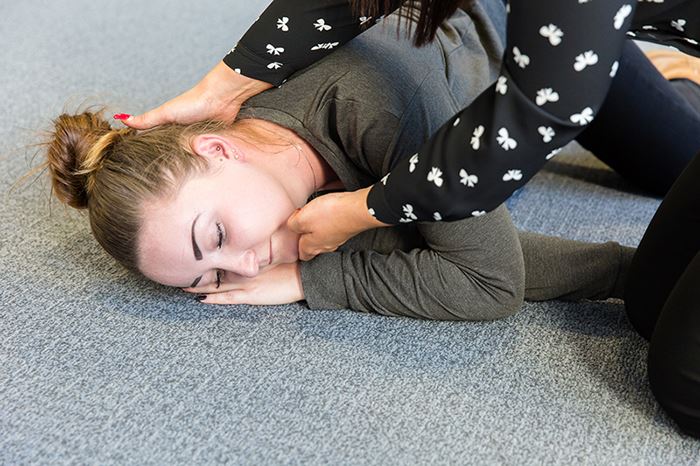 Woman in the recovery position