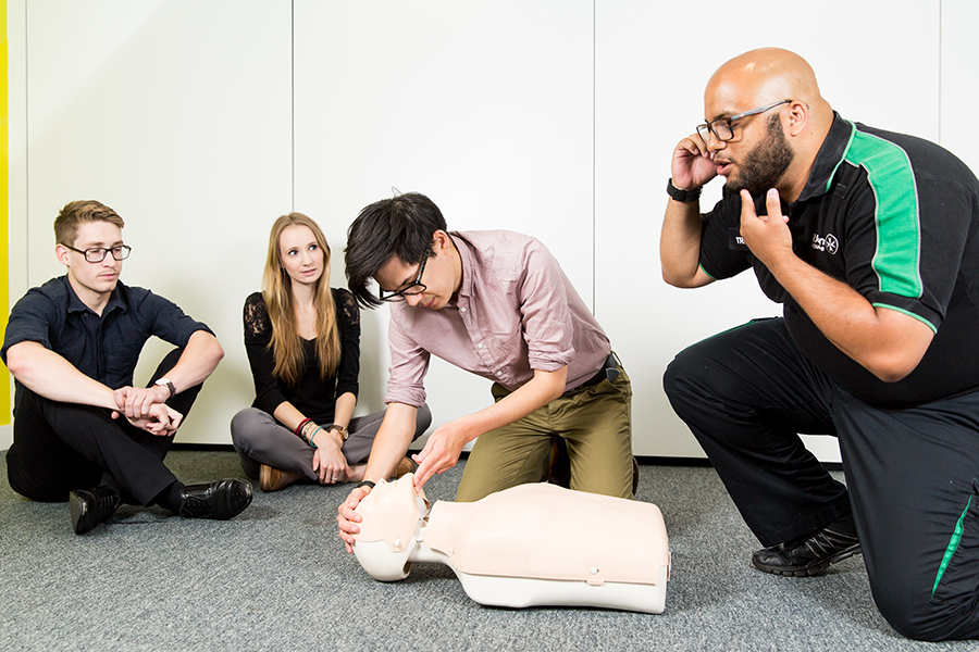 First aid course participants learning CPR.