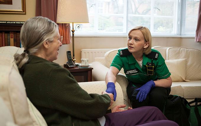 St John Ambulance Community First Responder helping patient St John Ambulance Community First Responder helping patient