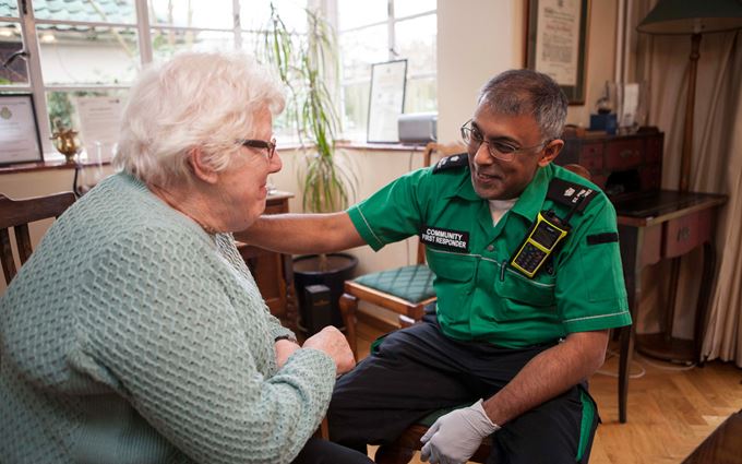 Community First Responder reassuring a patient Community First Responder reassuring a patient