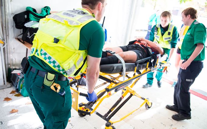 Paramedics carrying a patient on a stretcher