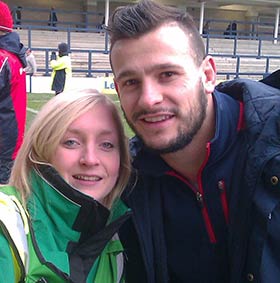 Student volunteer Emma Cooper with Danny Care from the England Rugby Team
