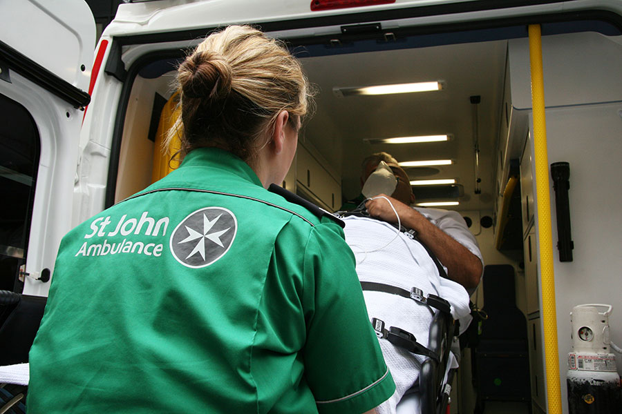 St John Ambulance team transporting patient