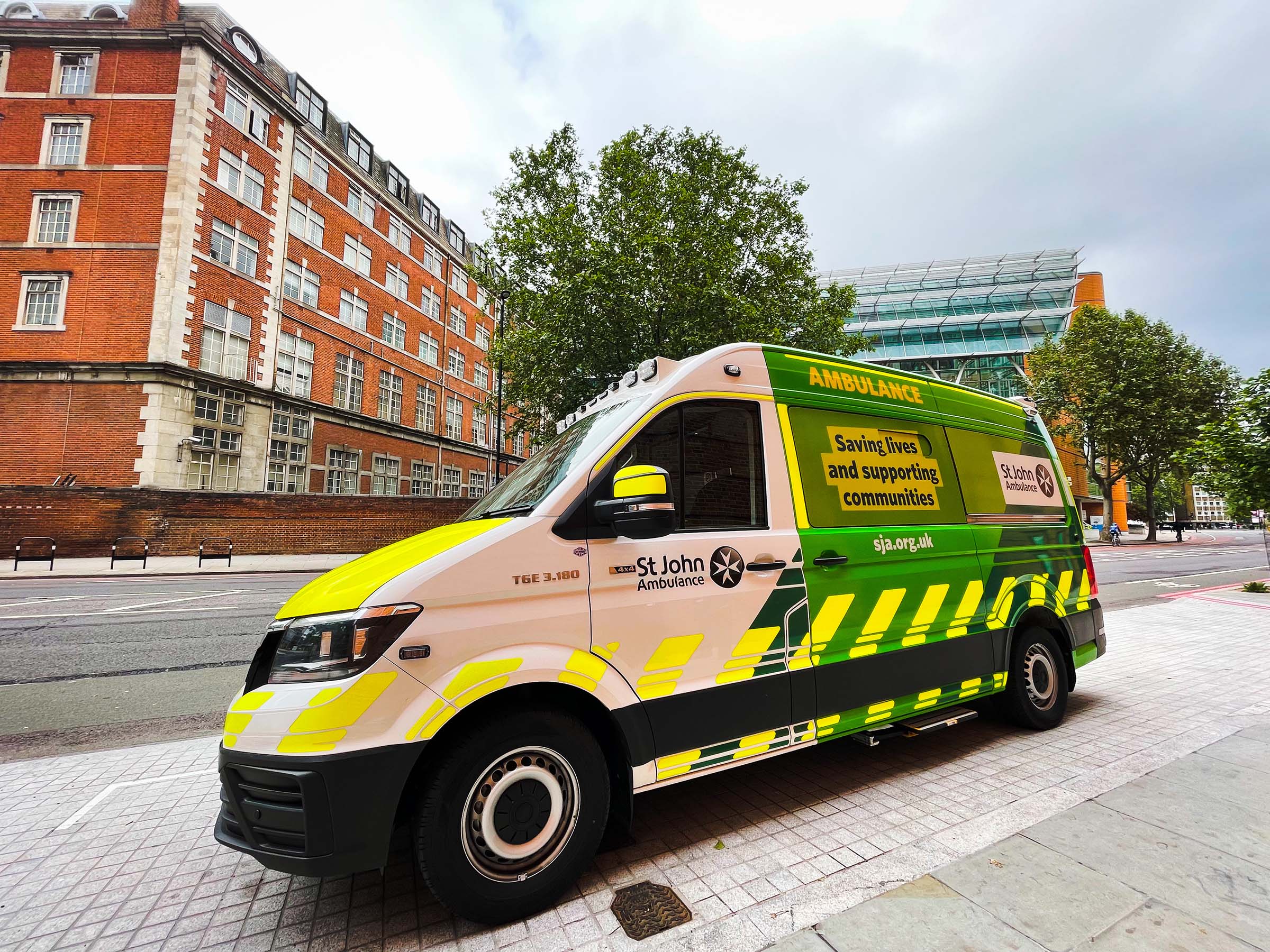 St John Ambulance parked in front of a brick building