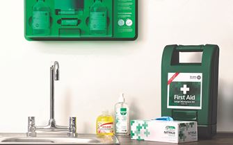 First aid room showing first aid kit, eye wash station and gloves First aid room showing first aid kit, eye wash station and gloves