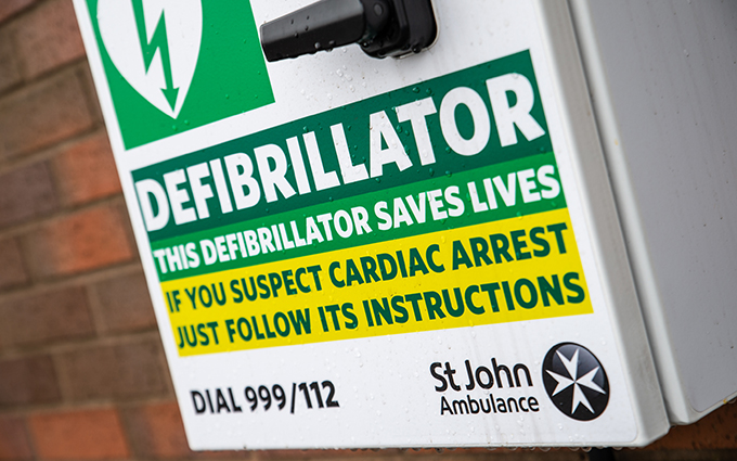 St John Ambulance defibrillator cabinet on a wall St John Ambulance defibrillator cabinet on a wall
