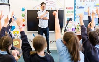 Class of primary school children learning Class of primary school children learning