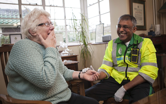 Community First Responder with elderly lady Community First Responder with elderly lady