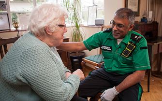 Community first responder reassures elderly lady Community first responder reassures elderly lady