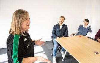 St John Ambulance trainer talks to a small group on a Mental Health Awareness course. St John Ambulance trainer talks to a small group on a Mental Health Awareness course.