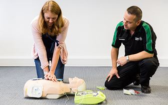 St John Ambulance class participant practicing CPR using a training mannequin St John Ambulance class participant practicing CPR using a training mannequin