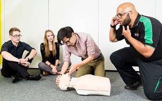 First aiders learning CPR First aiders learning CPR