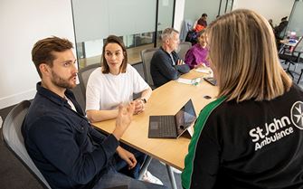 Training small pod talking at table Training small pod talking at table